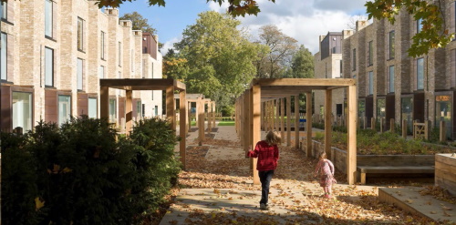 An illustrative image of a young family playing in a communal residential courtyard.  
					The map shows routes around Northampton between different residential areas, showcasing points of interest around the town.
					There are interactive map markers which show illustrative photographs of how these areas could look.